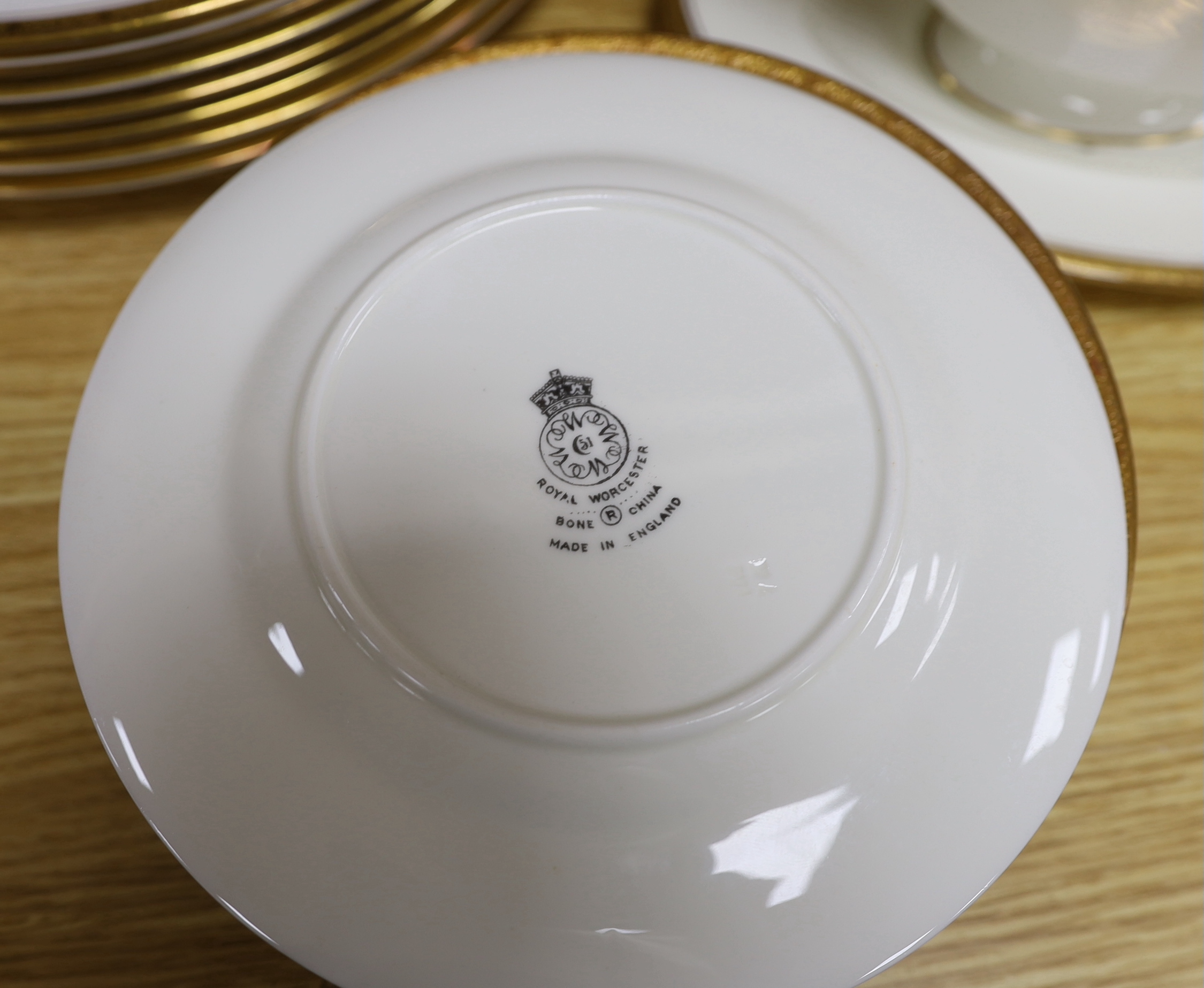 Royal Worcester Chancellor porcelain dinner service including side plates, soup bowls and sauce boat, the largest each 27.5cm in diameter